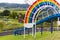 A large rainbow slide in a park