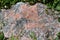 A large red and black Feldspar, Quartz and Granite mixed rock