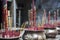 Large red incense sticks with Chinese characters on them in bronze pots in a Buddhist temple in Ho Chi Minh City