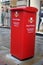 Large red parcel postbox in street in Manchester