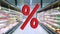 Large red Percentage sign on blur image of supermarket background. Rising food price. Inflation concept. Retail industry. Finance