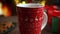 Large Red Steaming Mug of Hot Cocoa with Creamy Foam on Top - Christmas Atmosphere by the Fireplace