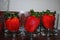 Large red sweet strawberries the size of a glass