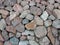 Large red tan stone rocks pile group overhead view with deep shadows and bright details as backdrop background for website