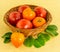 Large red tomato in a wicker brown basket with a heart-shaped fruit with green leaves