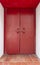 Large red wooden door. The old vintage retro door made of hardwood