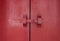 Large red wooden door. The old vintage retro door made of hardwood