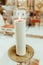 A large religious candle lit inside a church