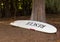 Large rescue surf board in woods