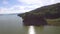 Large reservoirs of water hydro electric dam submerging part of the mountain side. aerial drone shot