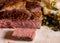 Large rib eye steak on white plate with kale and potatoes