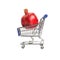 Large ripe pomegranate lies in a supermarket trolley on a white background