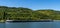 Large river barge transporting goods on the Moselle River near Enkirch