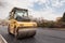 Large road-roller paving a road. Road construction