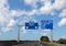 large road sign with the French places to reach the city of Paris or Amiens