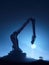 A large robotic arm hovering in a starlit sky representing the potential for human enhancement in the years to come.. AI