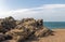 Large Rock Formation on Shoreline of Beach