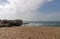 Large Rock Formation on Shoreline of Beach