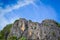 Large rocky mountains in the blue sky background