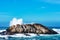 Large rough wave breaking over Bird Rock on a historic 17-Mile Drive at Monterey Bay on California Pacific Ocean coast during