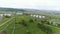 Large Round Gas Tanks among Wide Valley Panorama