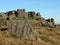 Large rugged gritstone outcrop at the bridestones a large rock formation in west yorkshire near todmordenwith blue sky and