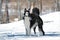 Large Russian sighthound dog poses proudly against a peaceful wintery backdrop