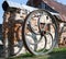 Large rusted metal industrial wheel against the background of an