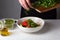 Large salad bowl on white table, cooking at home