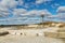 A large sand quarry and a lake. A flooded old abandoned quarry complex. Extraction of sand and stone for industrial applications