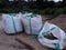 Large sandbags, big sand bags on construction site ready for building.