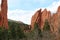 Large sandstone rock formations rising above evergreen trees at the Garden of the Gods in Colorado Springs