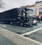Large Scania trucks stopped in the traffic signal in Berlin city streets