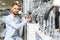 A large selection of water faucets. Man chooses a products in a sanitary ware store