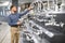 A large selection of water faucets. Man chooses a products in a sanitary ware store