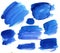 A large set of blue isolated watercolor spots in ultramarine color on a white background in different shades for the text