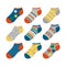 A large set of colored socks with various patterns and ornaments. children`s socks in a cartoon style