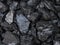Large shiny chunks of black heating coal, top view