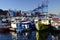 A large ship and fishing boats at the pier in the port of Valparaiso. Chili