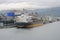 Large ships freighters in a busy port harbor