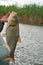 Large silver carp fisherman in his hand