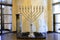 The large silver Hanukkah, a beautiful candlestick for 9 candles stands in the International Jewish Cultural Religious Center