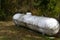 Large Silver Propane Tank Covered in Rust