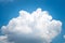 Large singleCumulonimbus clouds. cumulus cloud. Puffy or cotton like or fluffy cloud blue sky white fluffy clouds over blue sky