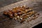 Large and small crystals of brown amber cane sugar on wooden board. group of sugar crystals sorted by size