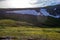 A large snowfield on the mountainside. Nature of the Northern Urals. Never melting snow in the mountains.