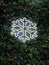 Large snowflake and small colorful Christmas lights background