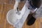 On a large spatula, apply a mixture for sealing cracks from a bucket, top view