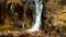 Large splashing cascading waterfall in the mountains