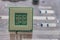 A large square microprocessor for computers lies on motherboard